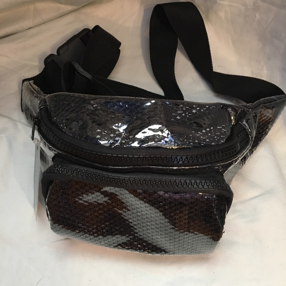 Fanny pack. Clear with a black net lining.